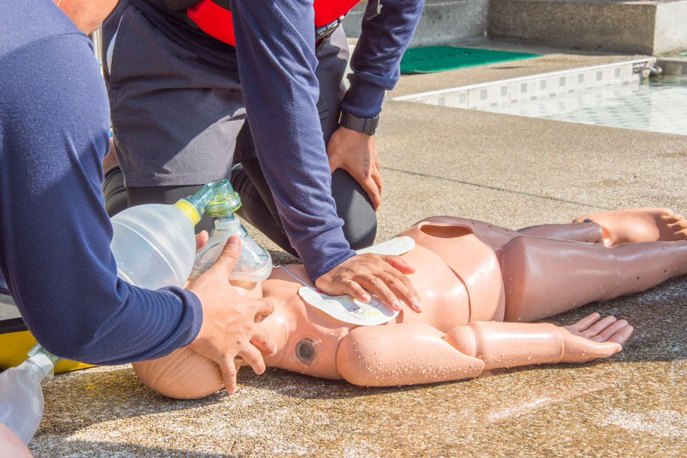 cpr-training-dummy-child-drowning-by-one-hand-use-air-mask-bag-unit-help-ventilation